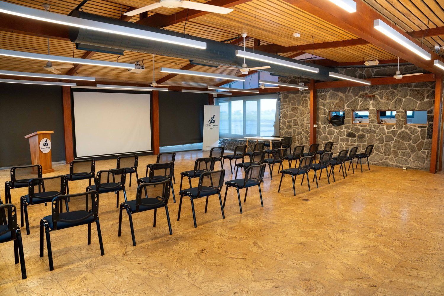 Charles Darwin Research Station — Inspiration Complex main hall, with presentation stage and ocean views